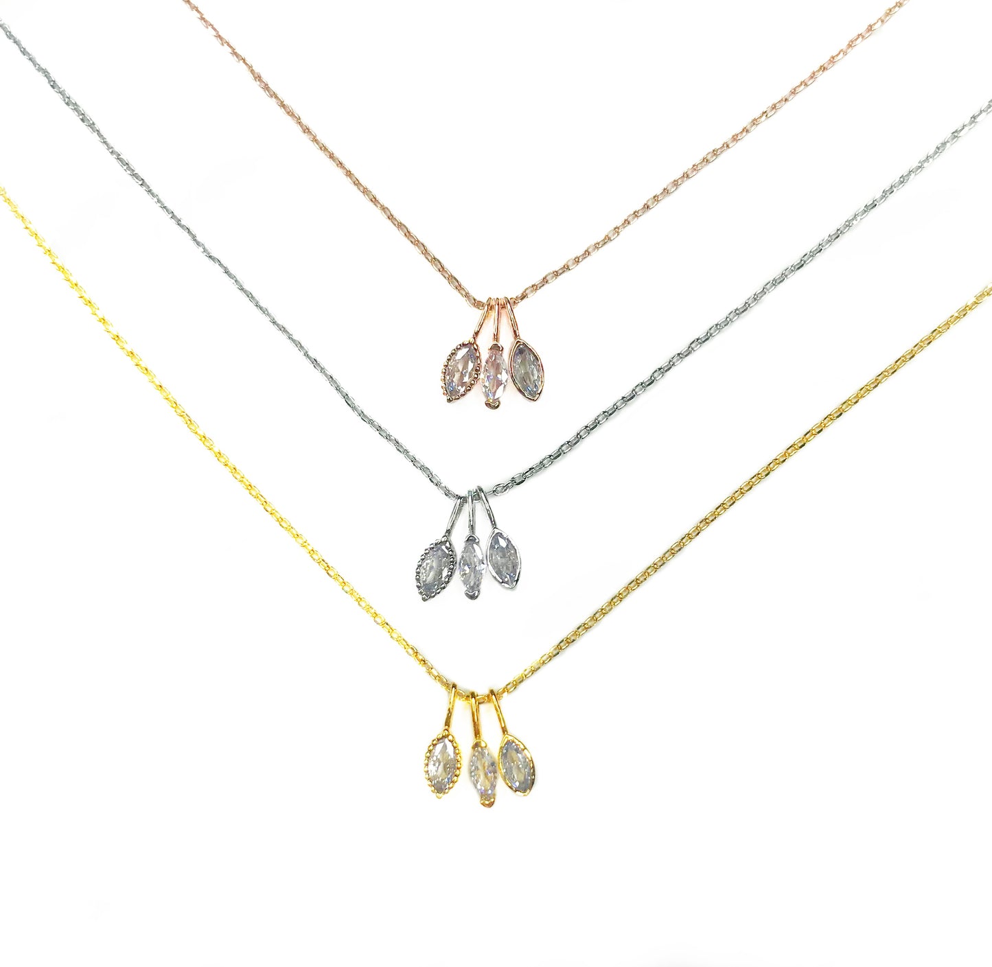 three necklaces with pear charms yellow white rose