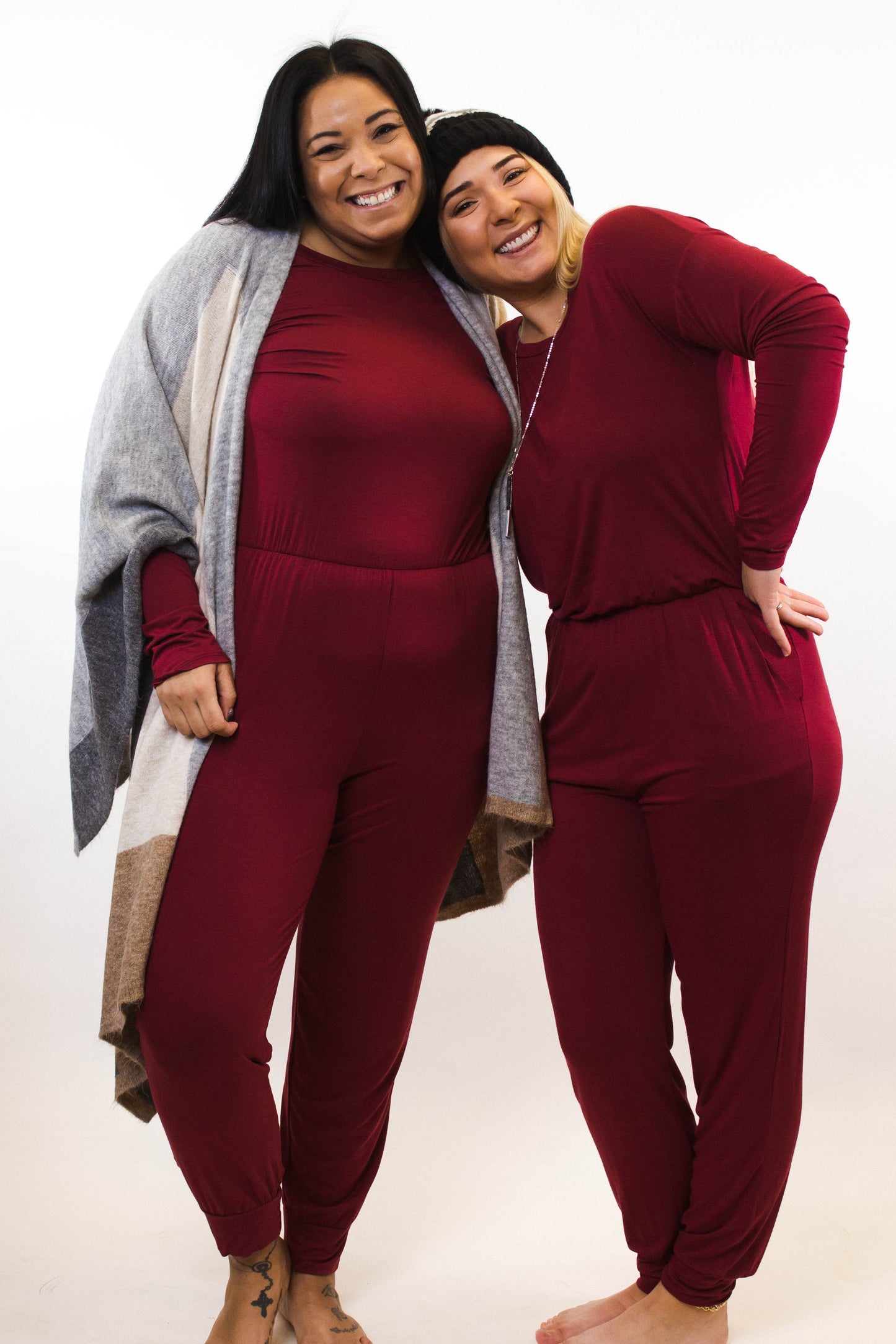 two women wearing red jumpsuits